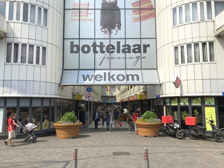 Almere, Netherlands - May 26, 2018: Entrance of Dutch mall 'Bottler' in the city of Almere City, with unidentified people walking by.のeditorial素材