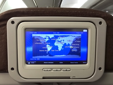 Jakarta, Indonesia - August 18, 2018: Airplane seat monitor displaying flight progress and information during a flight between Jakarta and Singapore.のeditorial素材