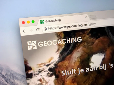 Amsterdam, Netherlands - May 9, 2018: Website or geocaching.com. Geocaching is an outdoor game...