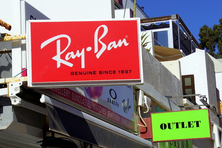 Puerto de Mogan, Gran Canaria, Spain - December 31, 2018: Ray-Ban retail sign mounted on the facade of a building.のeditorial素材