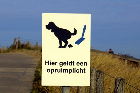 Noordwijk, the Netherlands - January 20, 2019: Dutch sign stating: here is a clean-up obligation.のeditorial素材