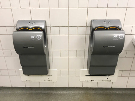 Amersfoort, the Netherlands - January 27, 2019: Two gray Dyson Airblade hand dryers.