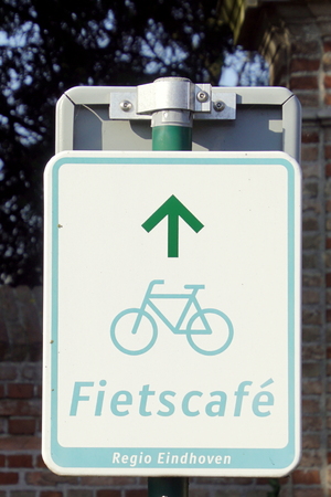 Geldrop, the Netherlands - February 17, 2019: Direction sign showing the way to a bicycle cafe (Dutch: Fietscafe)のeditorial素材