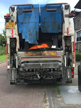 Almere, Flevoland, the Netherlands - August 14, 2019: Backside of a MAN garbage truck.