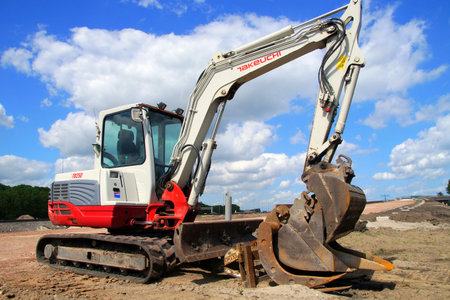 Naarden, the Netherland - July 6, 2015: Takeuchi TB250 excavator standing at a construction site...