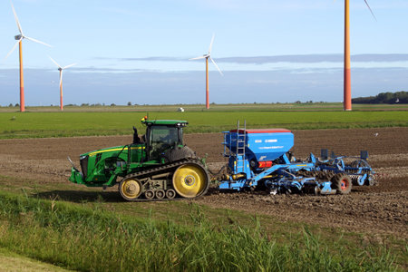 Almere Poort, the Netherland - September 20, 2019: John Deere tracked vehicle on a field in the city...