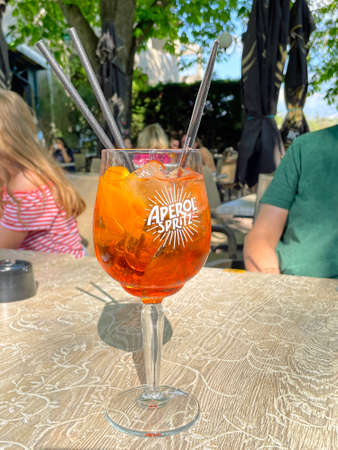 GrÃ©oux-les-Bains, France - April 27, 2022: Glass of Aperol Spritz on a restaurant table.のeditorial素材