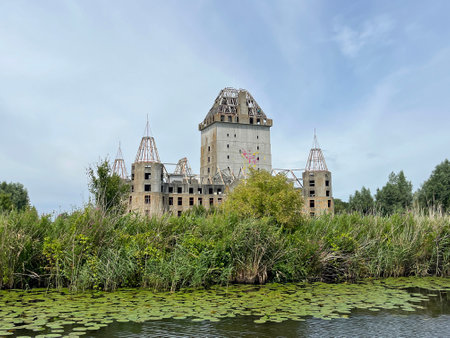 Almere, the Netherlands - July 12, 2022: Modern Ruin of Castle Almere against a clouded sky.のeditorial素材
