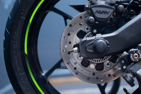 Close up of motorcycle front wheel break system.