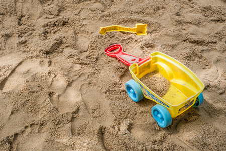 A close-up of a bucket truck in the sand of a beachの写真素材