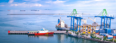 Logistics and transportation of Container Cargo ship with working crane bridge in shipyard, logistic...