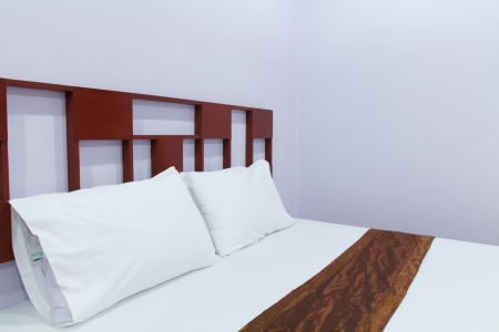 Comfortable soft pillows on the bedの写真素材