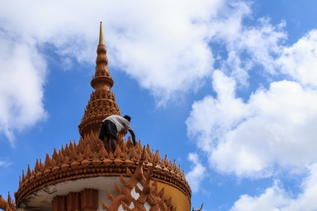 Man repair pagoda in Thai Templeの写真素材
