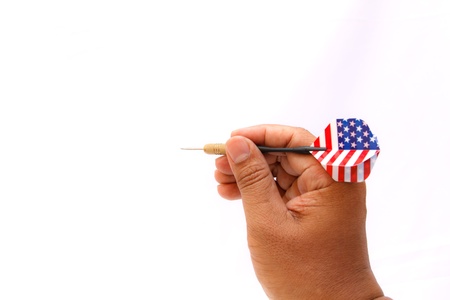 Arrow darts in hand isolated on white backgroundの写真素材