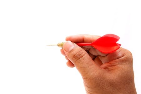 Red arrow darts in hand isolated on white backgroundの写真素材