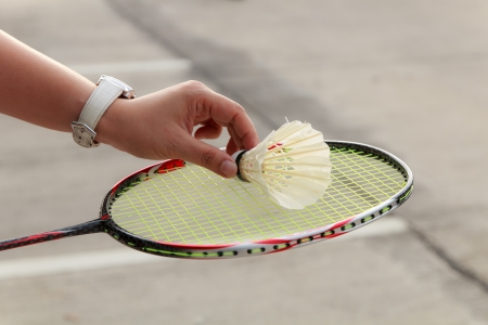 Woman hand badminton player with racket and shuttlecockの写真素材