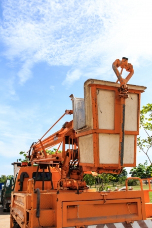 yellow crane car and blue sky backgroundの写真素材