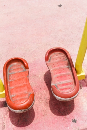 Empty chain swings on rural village playgroundの写真素材