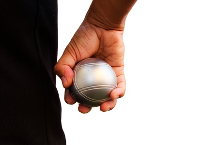 Man and petanque ball in handの写真素材