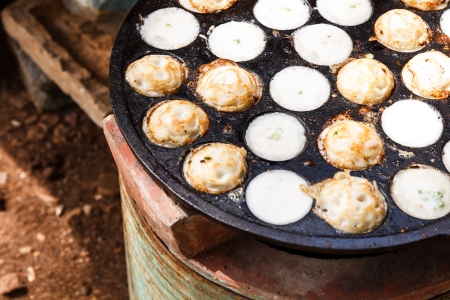Kind of Thai sweetmeat or Khanom-krok on processの写真素材
