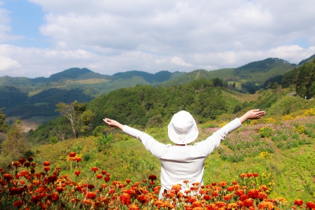 Asian woman relax in the flower gardenの写真素材