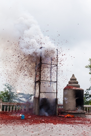 Red firecracker on working and smokeの写真素材