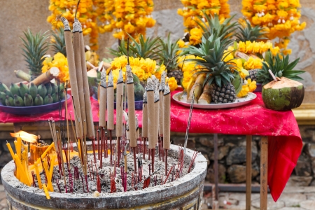 Burning incense sticks in brass Incense bowl and flower for pray の写真素材