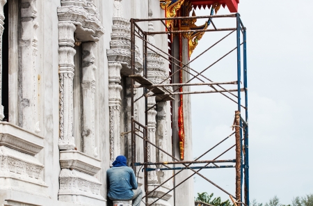 Construction worker working at the templeの写真素材