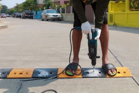 Construction worker working on the road sign, unsafety conceptの写真素材