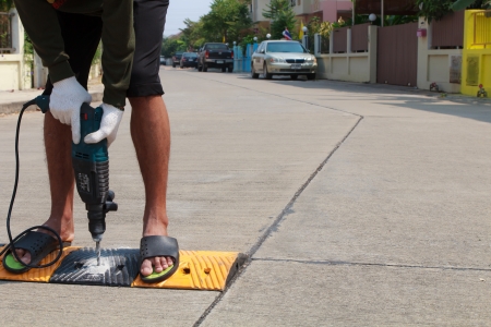 Construction worker working on the road sign, unsafety conceptの写真素材