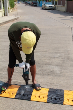 Construction worker working on the road sign, unsafety concept-の写真素材