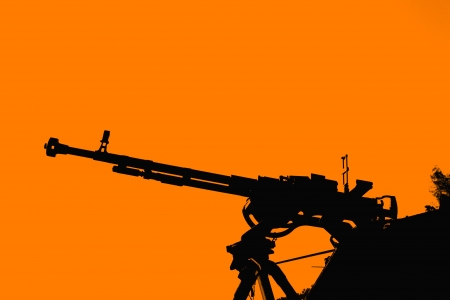 Silhouette of rifle with sky backgroundの写真素材