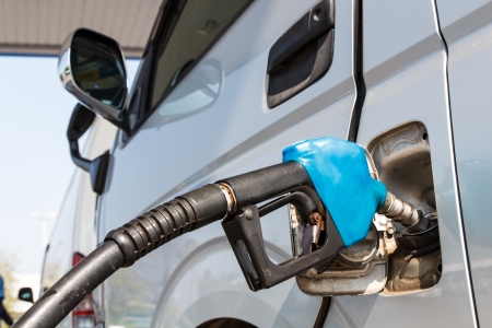 The machine with fuel fill with gasoline at a gas stationの写真素材