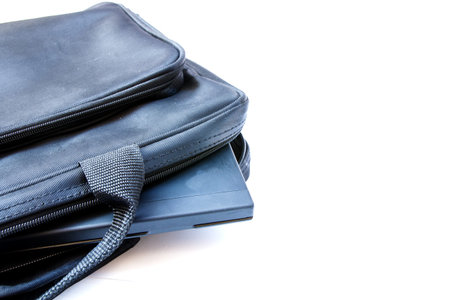 Computer bag open with laptop isolated on white の写真素材