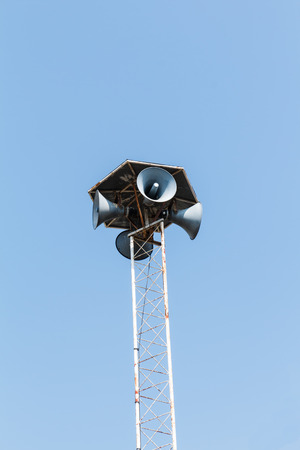 Four loudspeaker against blue skyの写真素材