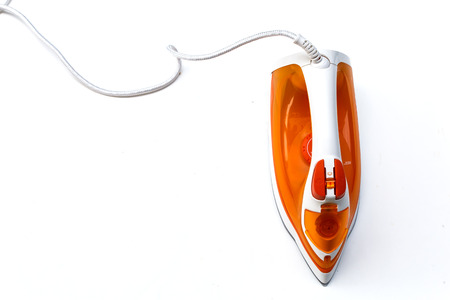Modern new electric iron on white backgroundの写真素材