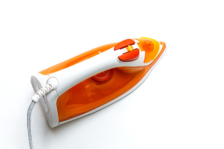 Modern new electric iron on white backgroundの写真素材