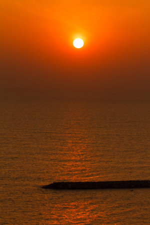 Reflection of sunlight on the water at sunrise view, Thailandの写真素材