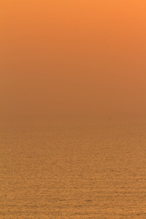 Background of sky and water sea at sunriseの写真素材