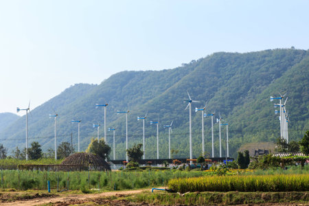 Wind turbines in farm and mountain background