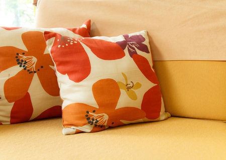 Beautiful handmade pillows on sofaの写真素材