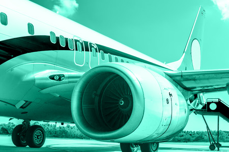 Engine of passenger airplane stop in airportの写真素材