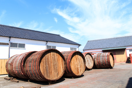 Wine barrels stacked in the old cellar of the wineryの写真素材