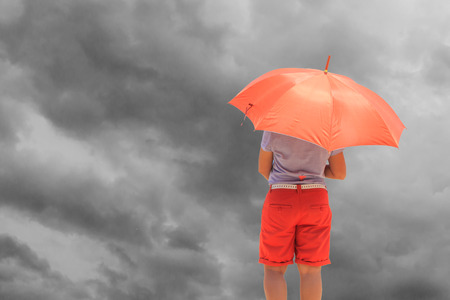 Woman with umbrella and sky backgroundの写真素材