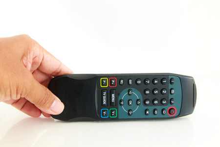 Hand show remote control on white backgroundの写真素材
