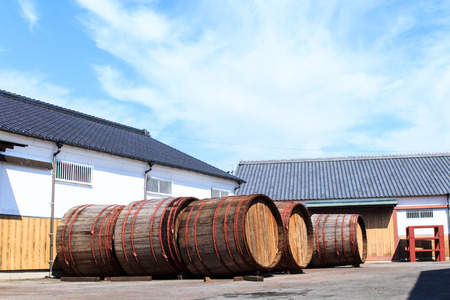 Wine barrels stacked in the old cellar of the wineryの写真素材