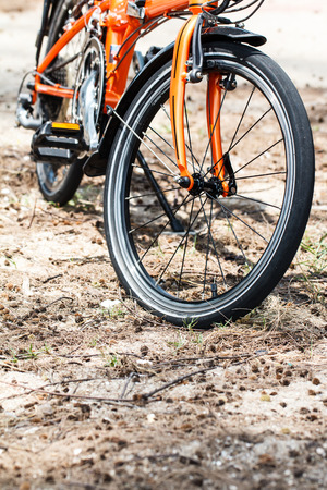 Close up of the orange bicycleの写真素材