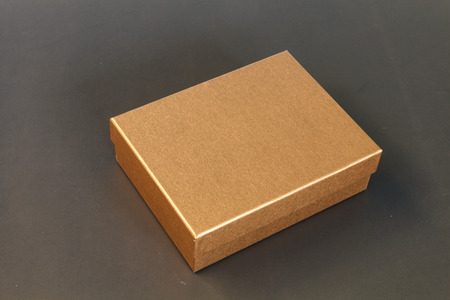 Brown paper box isolated on black backgroundの写真素材