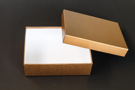 Brown paper box isolated on black backgroundの写真素材