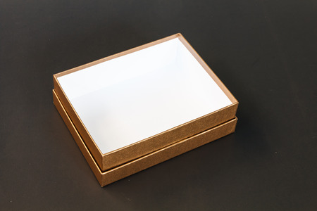 Brown paper box isolated on black backgroundの写真素材